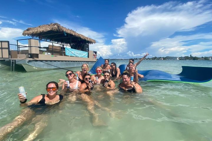 a group of people in a pool of water