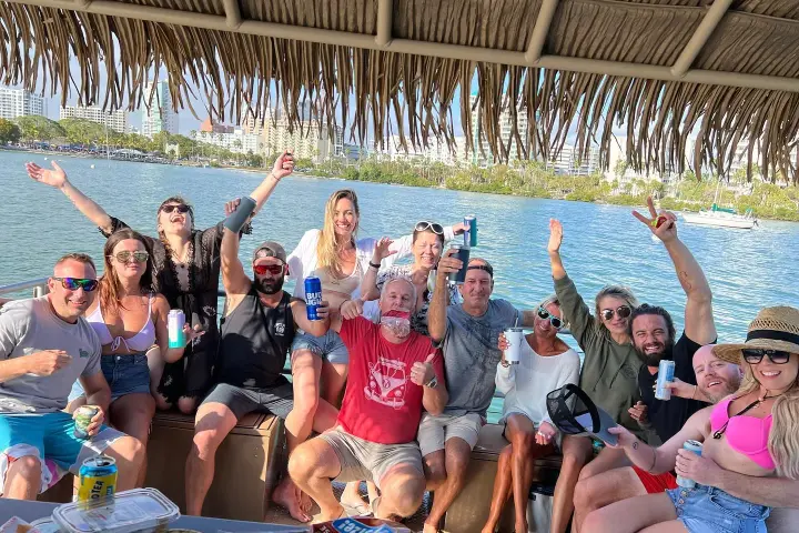 a group of people swimming in a pool of water