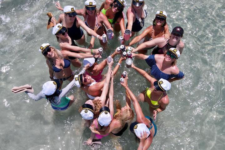 a group of people riding skis on a body of water