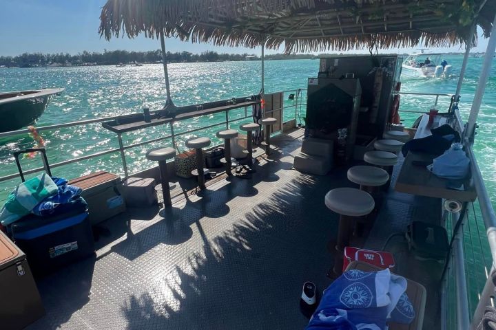 a group of people on a boat in the water